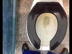Fresh yellow morning urinate relative to a public toilet